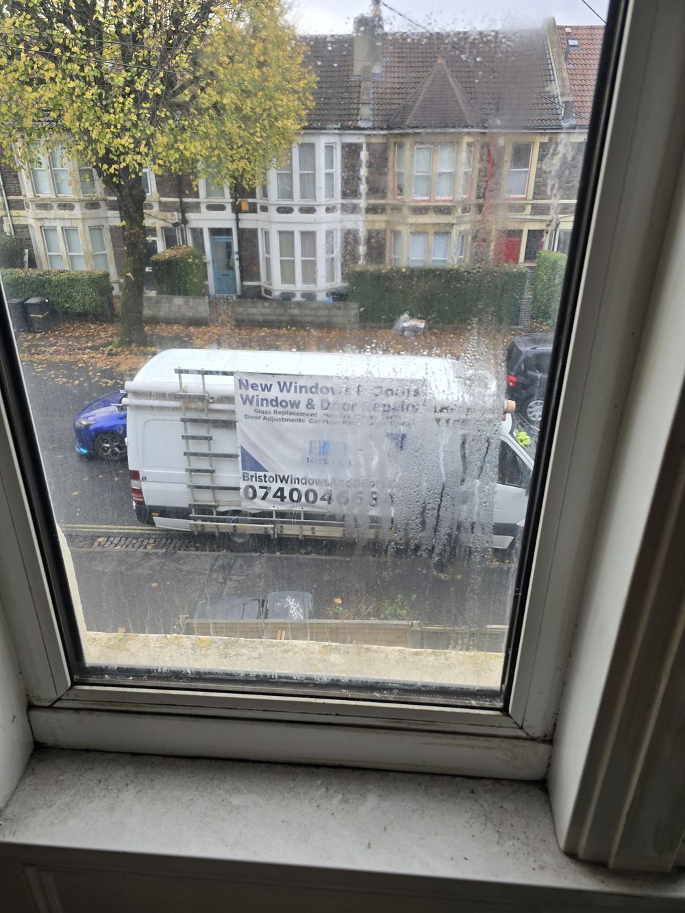 Misted double-glazed window before replacement — condensation visible between panes